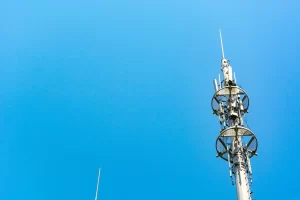 red-white-tower-communications-with-lot-different-antennas-blue-sky-clouds